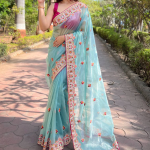 Pink Blouse With Thread Embroidered Sky Blue Net Saree
